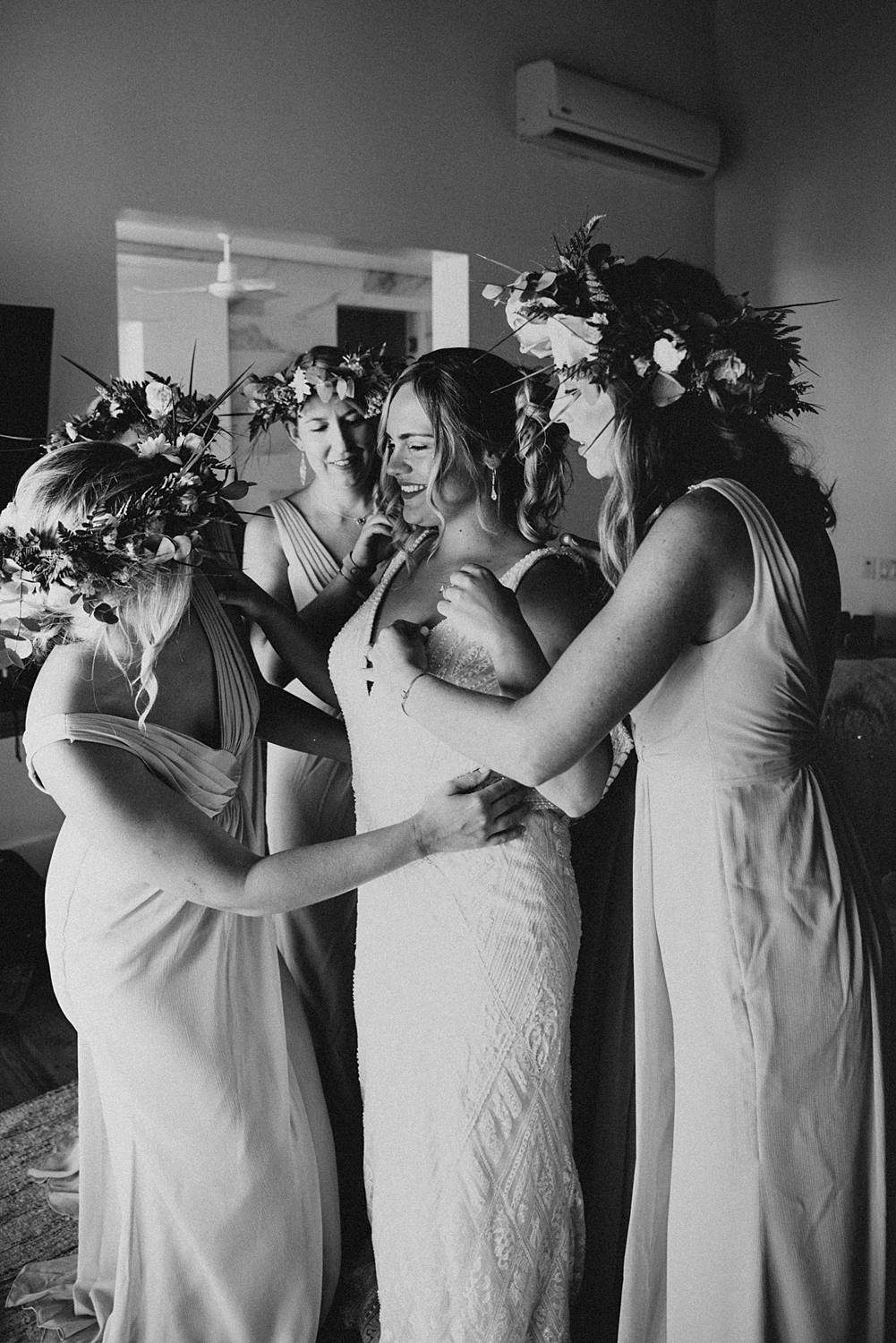 Bridesmaids getting bride ready