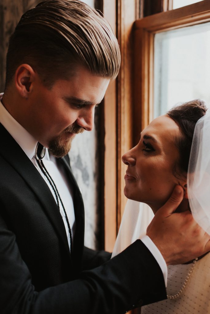 Bride and groo looking at each other