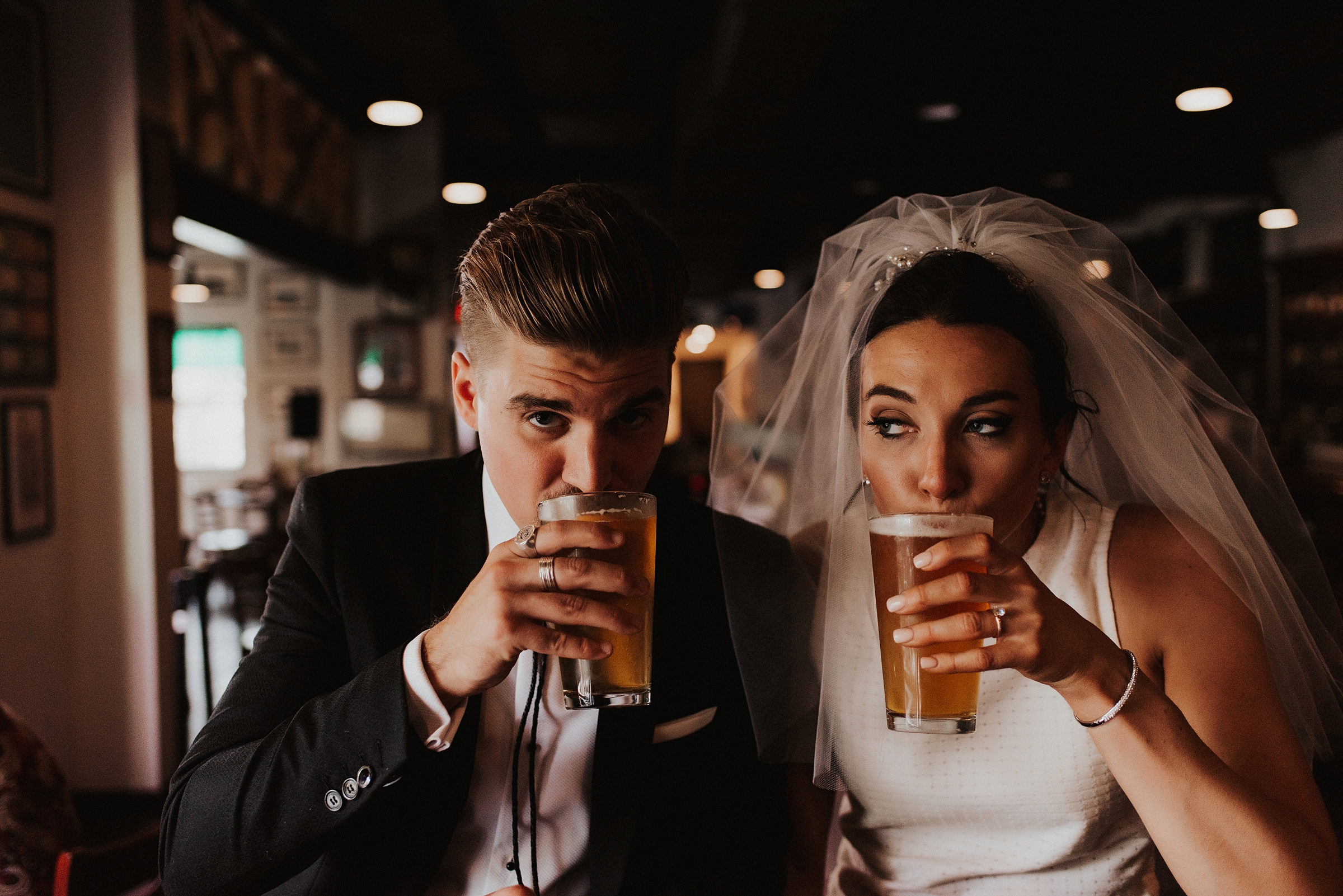 Bride and groom drinking craft beer in downtown tampa bar