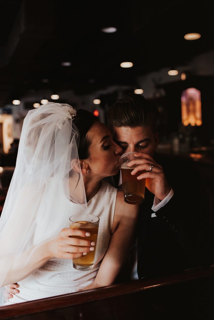 Bride and groom drinking craft beer in downtown tampa bar