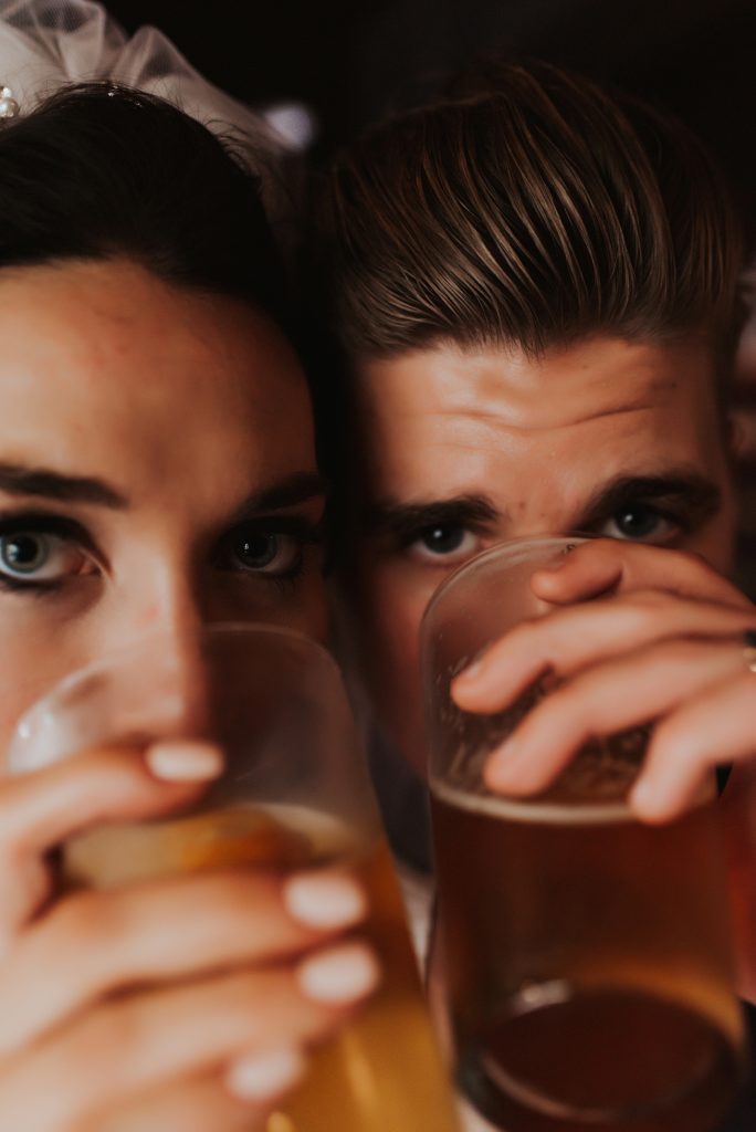 Bride and groom drinking craft beer in downtown tampa bar
