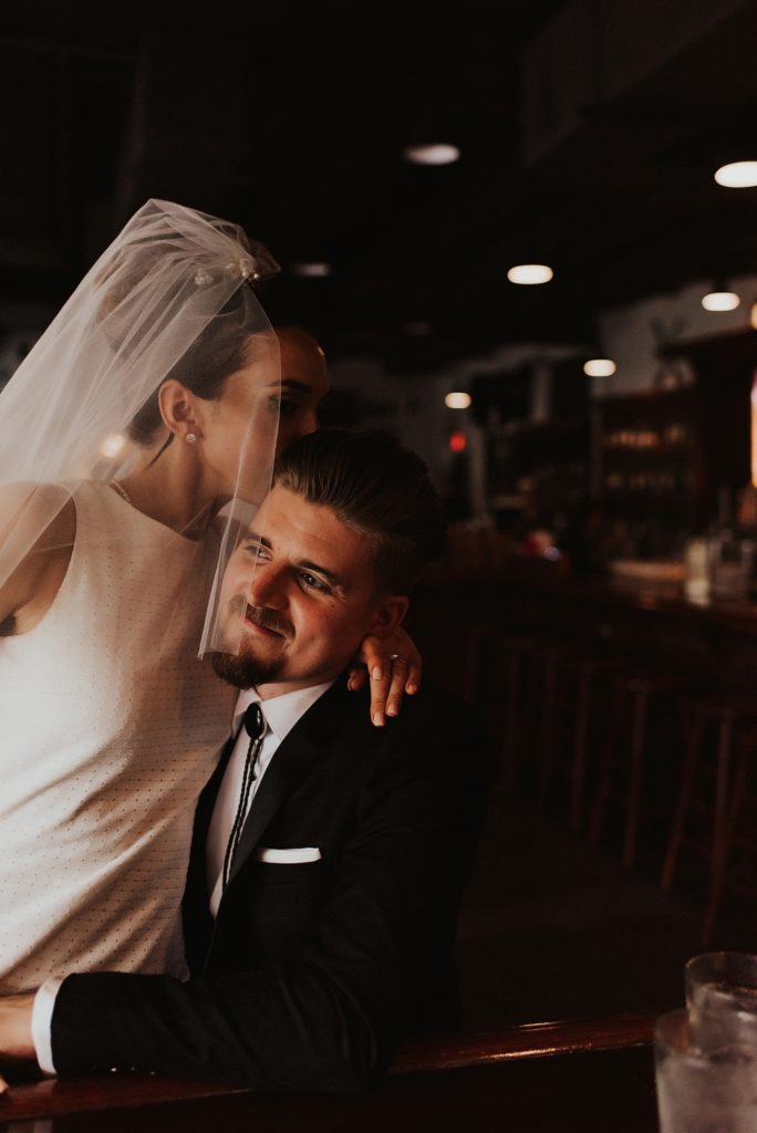 Bride and groom drinking craft beer in downtown tampa bar