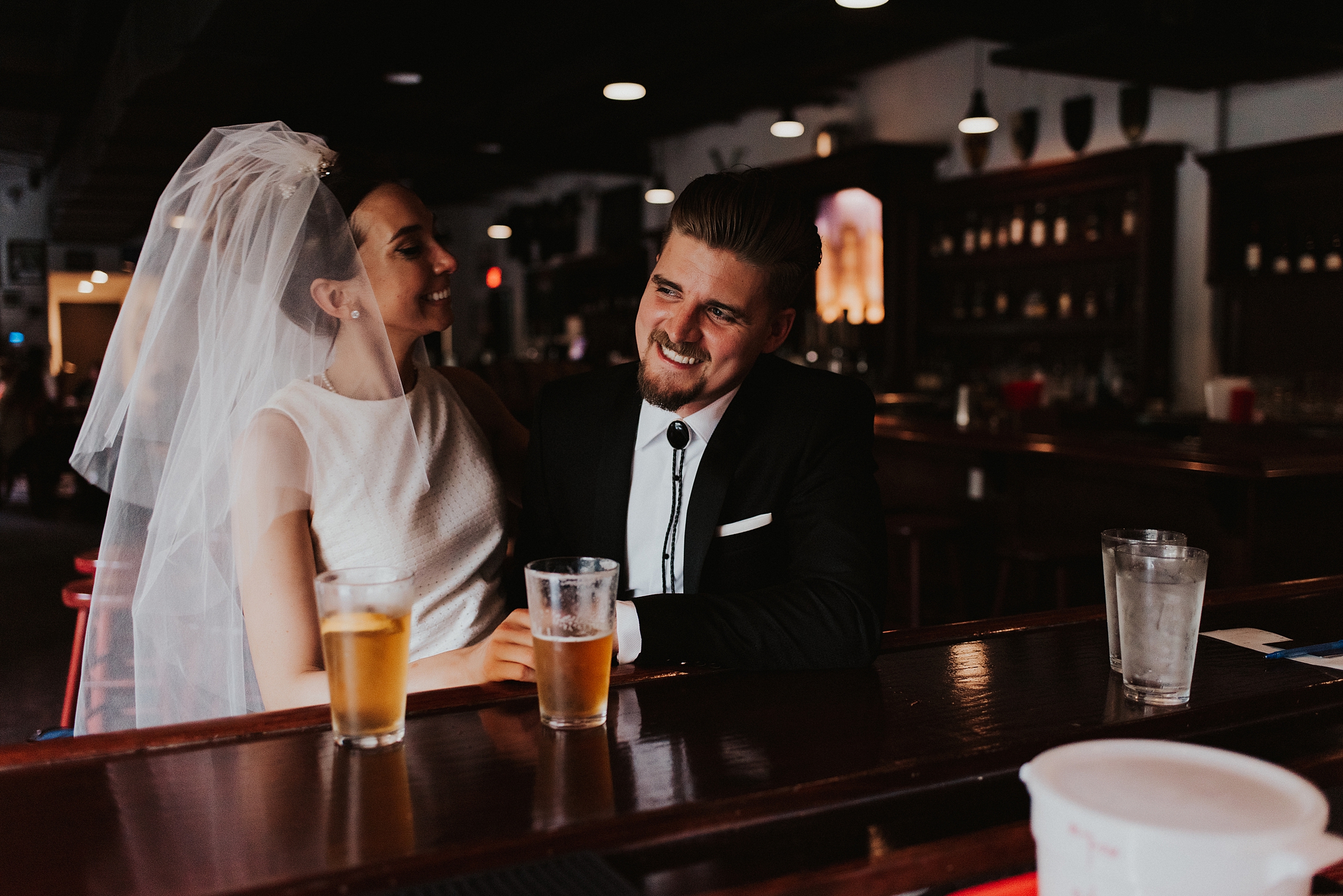 Bride and groom drinking craft beer in downtown tampa bar