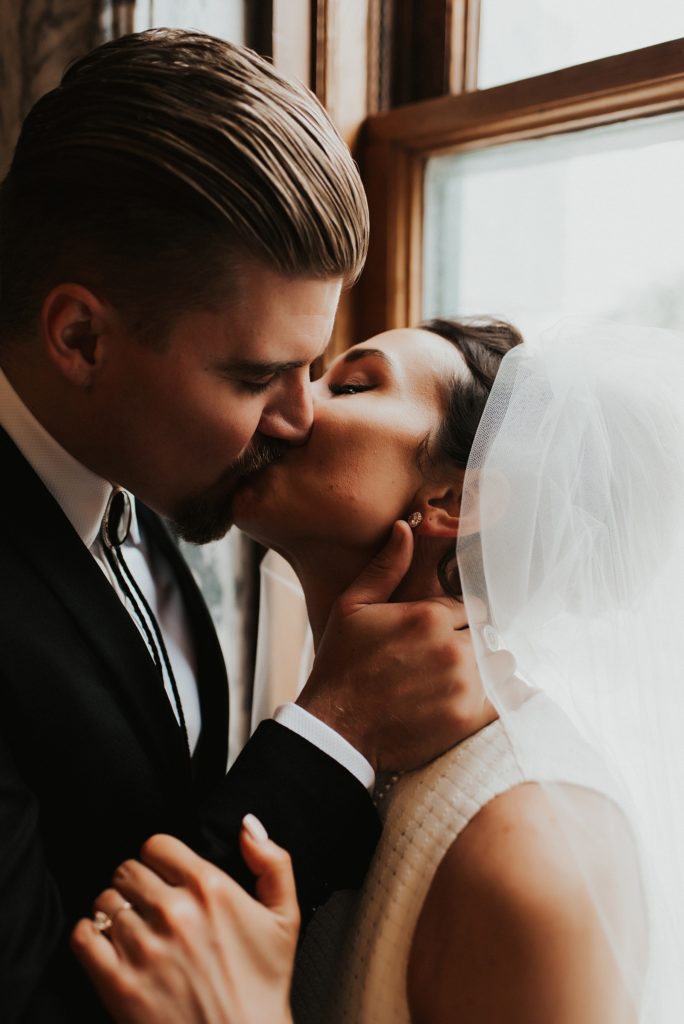 Bride and groom kissing