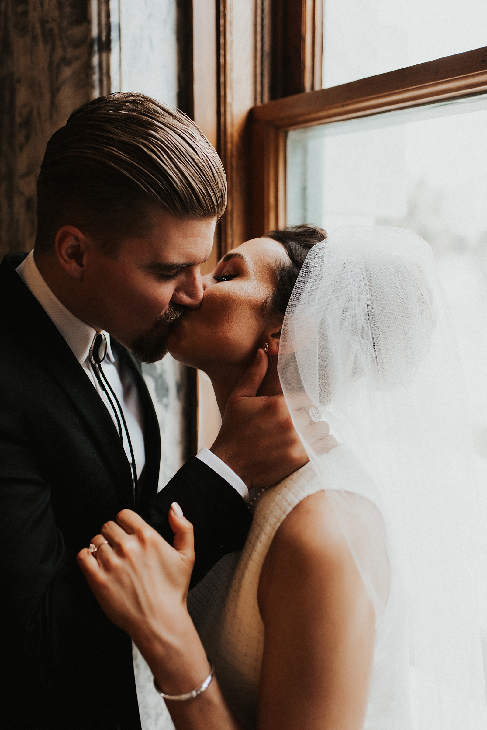 Bride and groom kissing