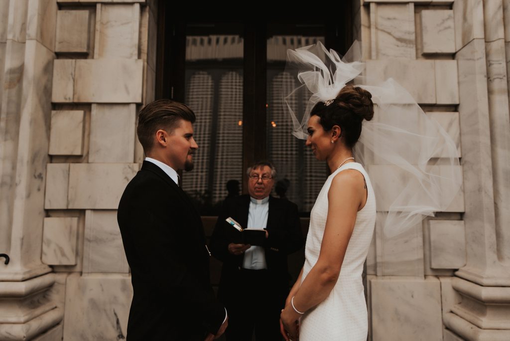 Brides veil flying in the wind on Le Meridien front steps