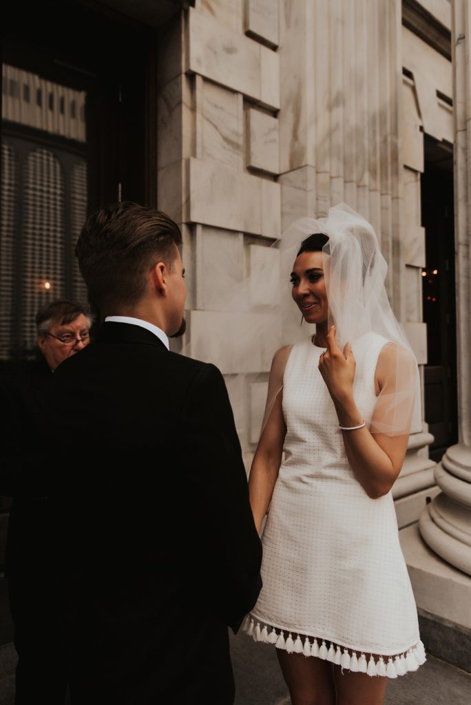 Bride fixing veil