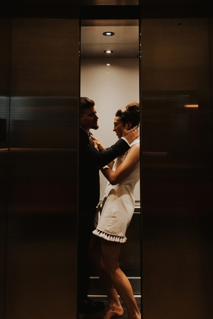 Bride and groom kissing in elevator in Le meridien tampa