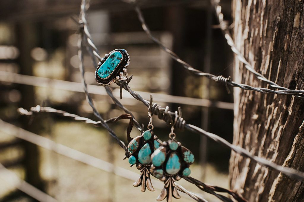 Detail photography of turquoise and silver wedding jewelry in Okeechobee barn