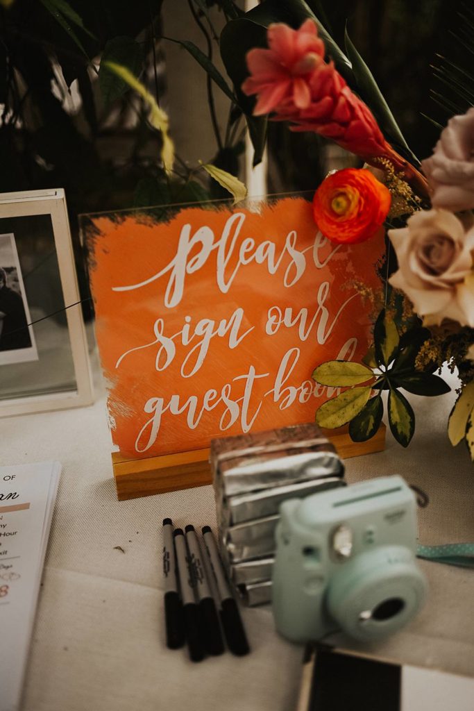 Guest table decor and guest book at the Historic Walton House in Homestead, Florida