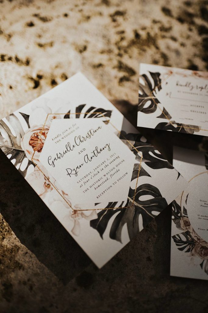 Tropical invitation suite flat lay at Historic Walton House in Homestead, Florida