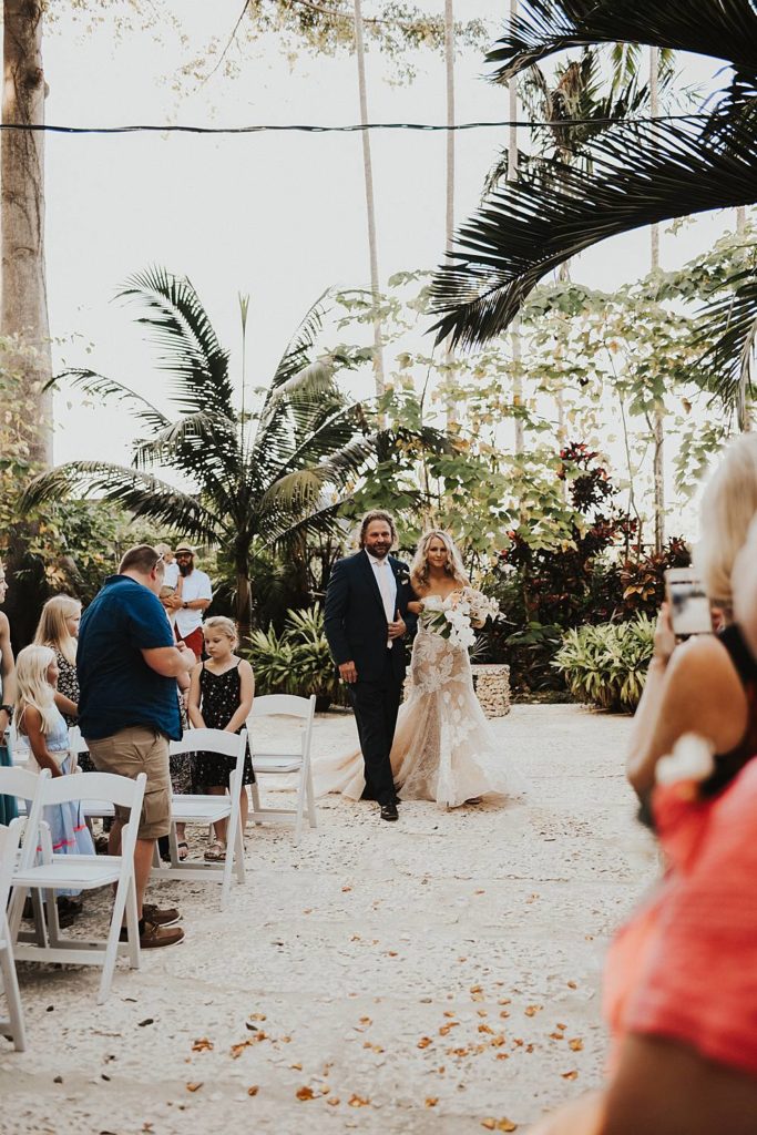 Father walking bride down the aisle at the historic walton house in homestead florida