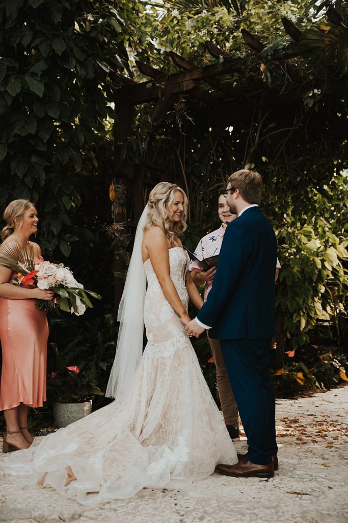 Bride and groom at the alter at the historic walton house in homestead florida