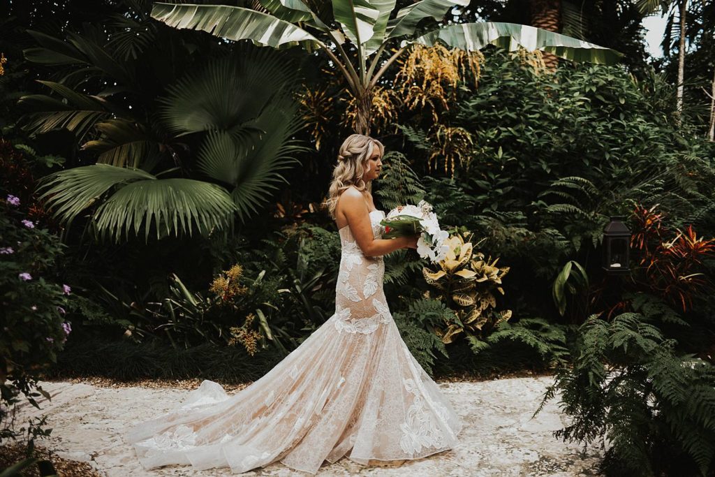 Bride walking to first look at the Historic Walton House in Homestead Florida