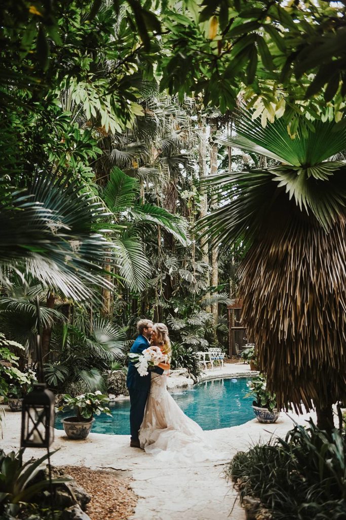Tropical bride and groom portrait at the historic walton house in homestead florida