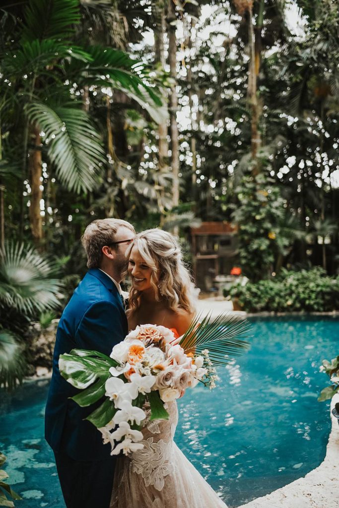 Tropical bride and groom portrait at the historic walton house in homestead florida