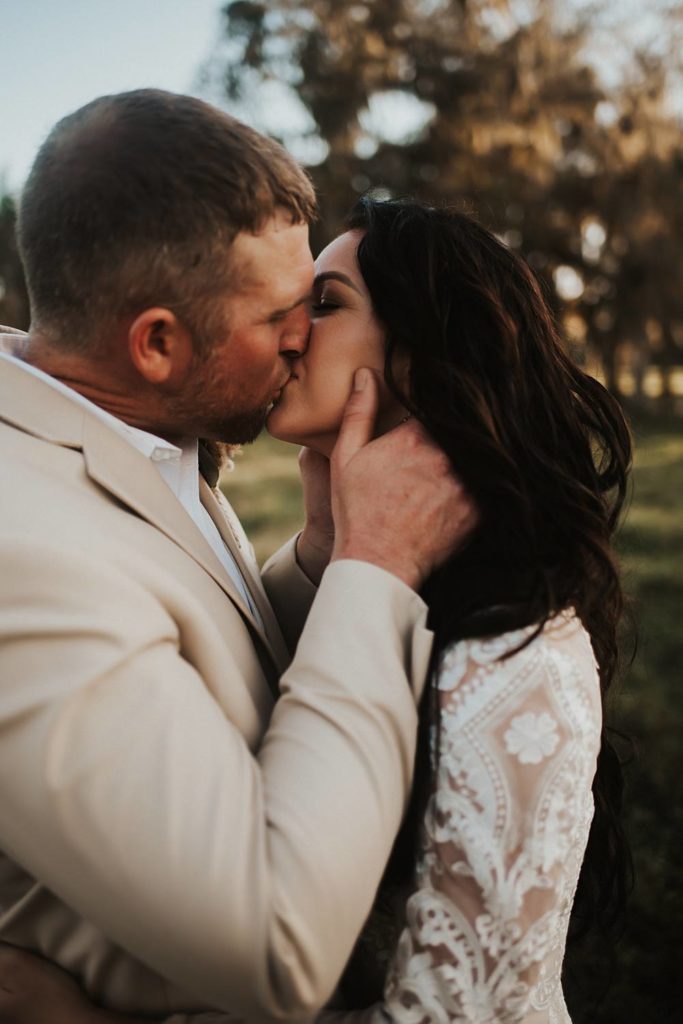 Western-inspired authentic Bride and groom portraits in pasture in okeechobee florida