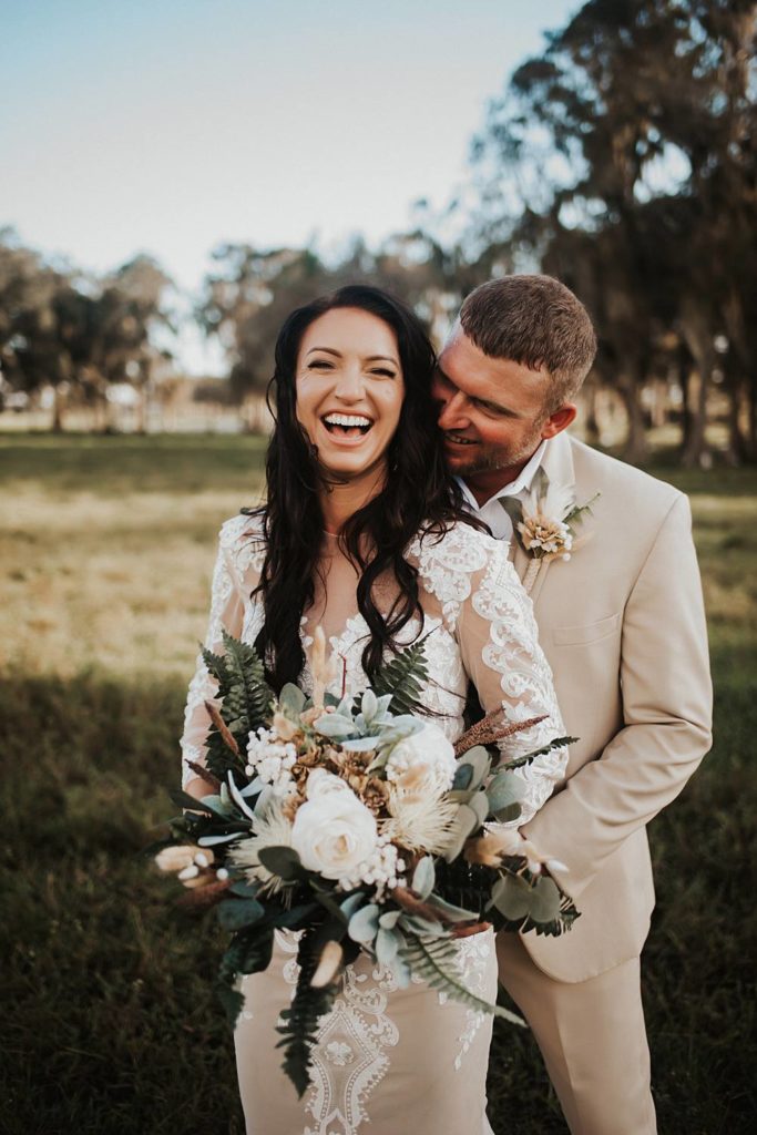Western-inspired authentic Bride and groom portraits in pasture in okeechobee florida