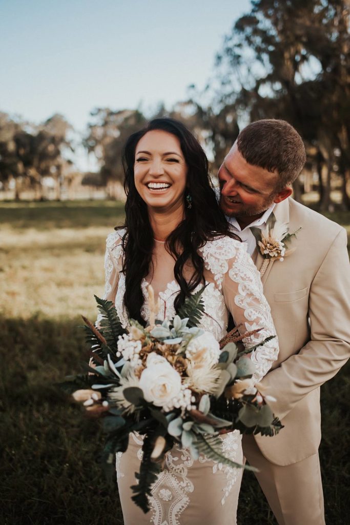 Western-inspired authentic Bride and groom portraits in pasture in okeechobee florida