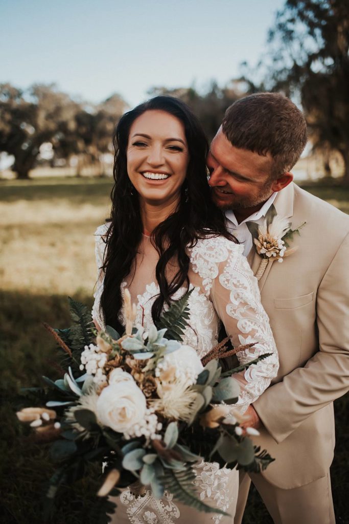 Western-inspired authentic Bride and groom portraits in pasture in okeechobee florida