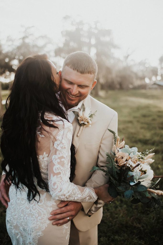 Western-inspired authentic Bride and groom portraits in pasture in okeechobee florida