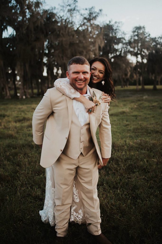 Western-inspired authentic Bride and groom portraits in pasture in okeechobee florida
