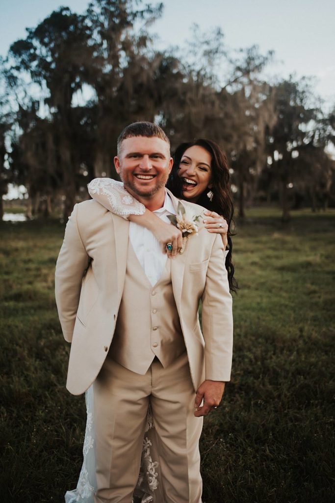 Western-inspired authentic Bride and groom portraits in pasture in okeechobee florida