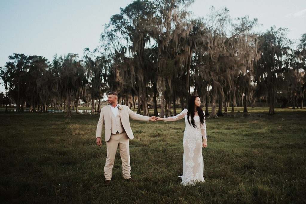 Western-inspired authentic Bride and groom portraits in pasture in okeechobee florida