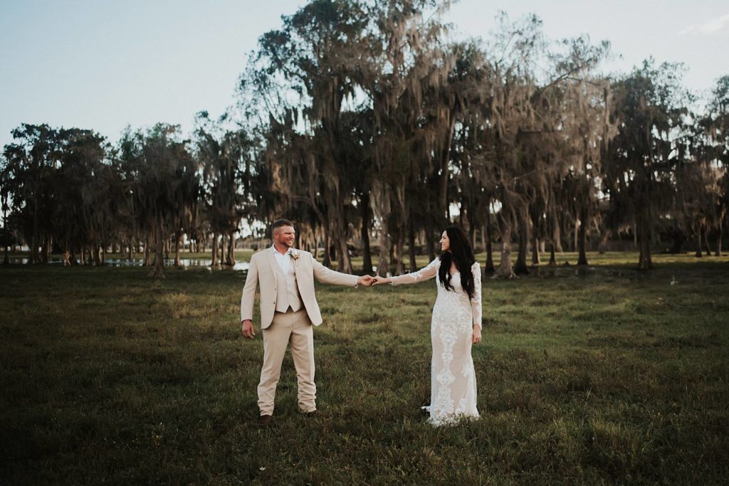 Western-inspired authentic Bride and groom portraits in pasture in okeechobee florida