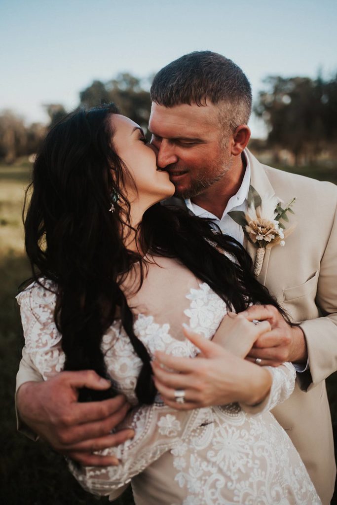Western-inspired authentic Bride and groom portraits in pasture in okeechobee florida