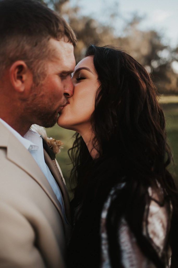 Western-inspired authentic Bride and groom portraits in pasture in okeechobee florida