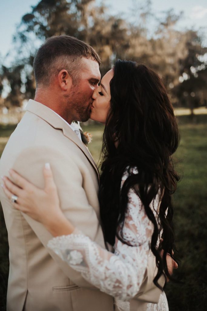 Western-inspired authentic Bride and groom portraits in pasture in okeechobee florida