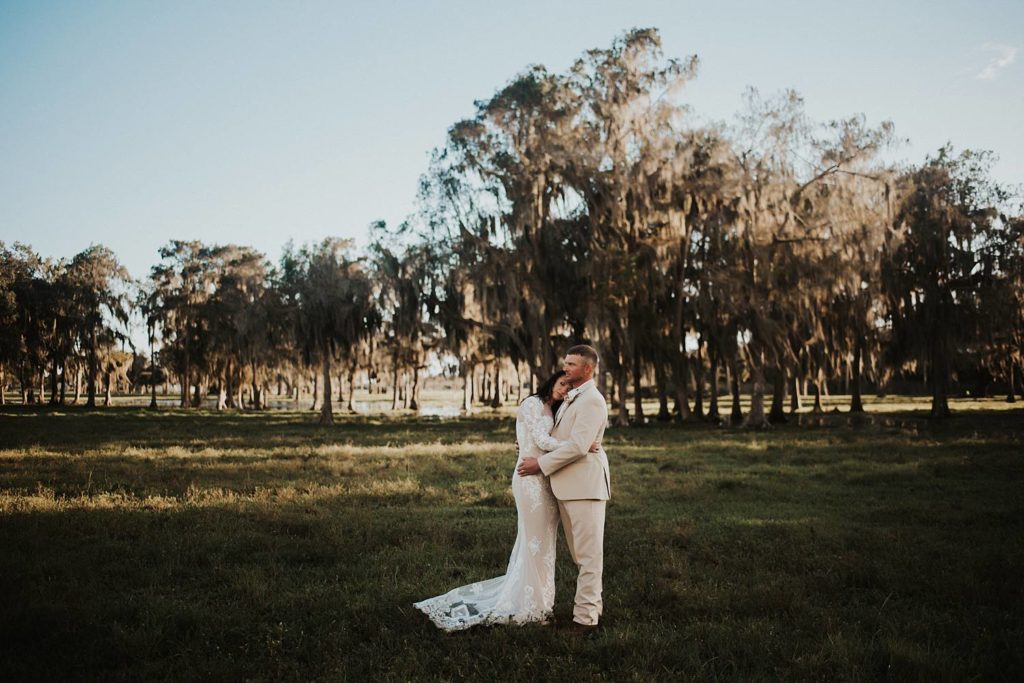 Western-inspired authentic Bride and groom portraits in pasture in okeechobee florida