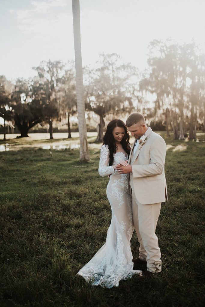 Western-inspired authentic Bride and groom portraits in pasture in okeechobee florida