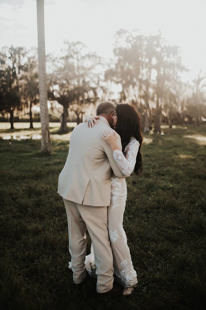 Western-inspired authentic Bride and groom portraits in pasture in okeechobee florida