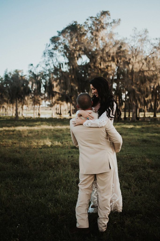 Western-inspired authentic Bride and groom portraits in pasture in okeechobee florida
