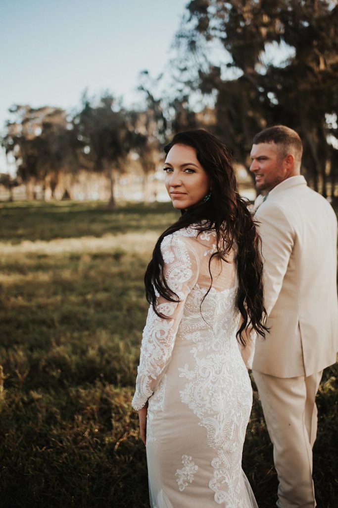 Western-inspired authentic Bride and groom portraits in pasture in okeechobee florida