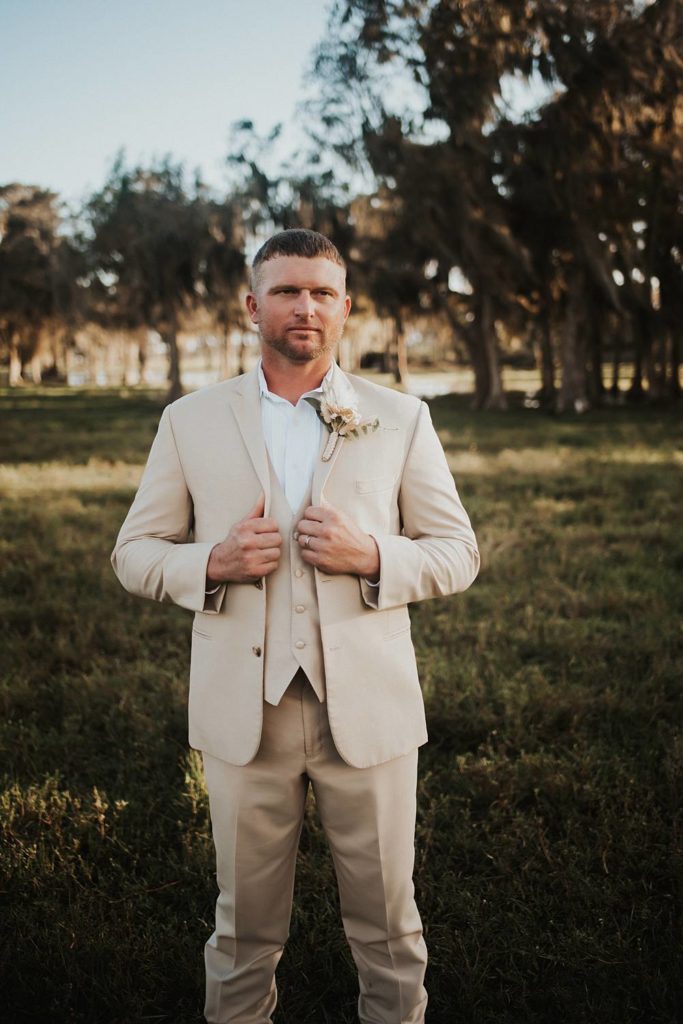 Western-inspired groom portraits in pasture in okeechobee florida