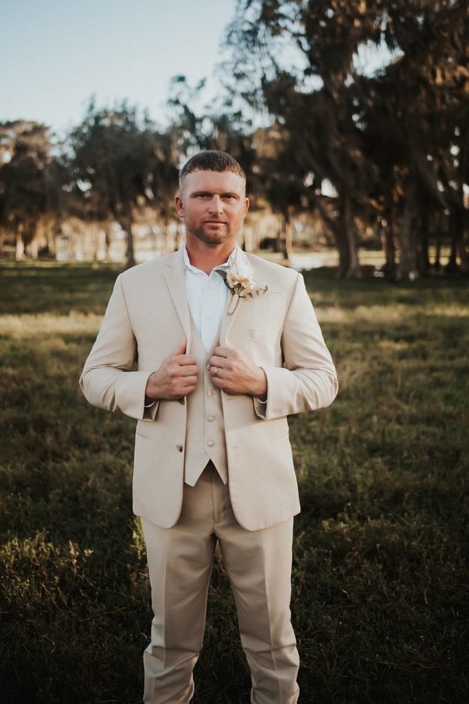 Western-inspired groom portraits in pasture in okeechobee florida