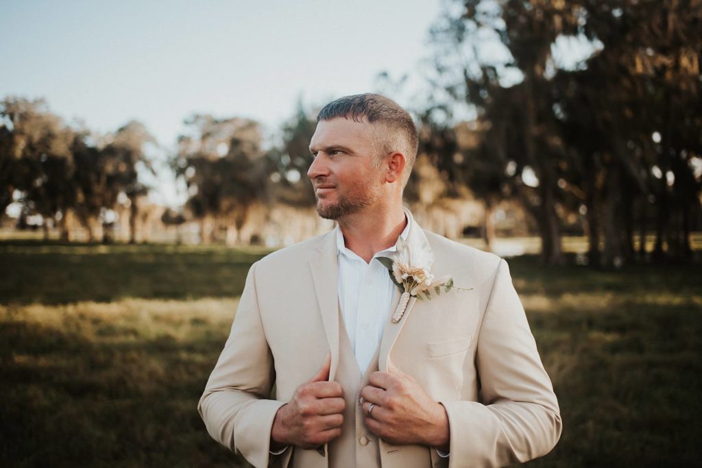 Western-inspired groom portraits in pasture in okeechobee florida