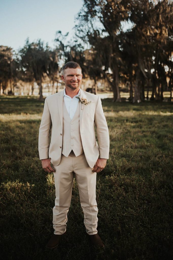 Western-inspired groom portraits in pasture in okeechobee florida