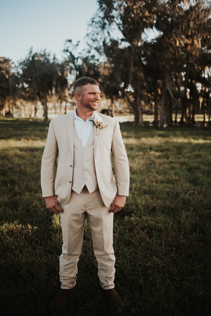 Western-inspired groom portraits in pasture in okeechobee florida