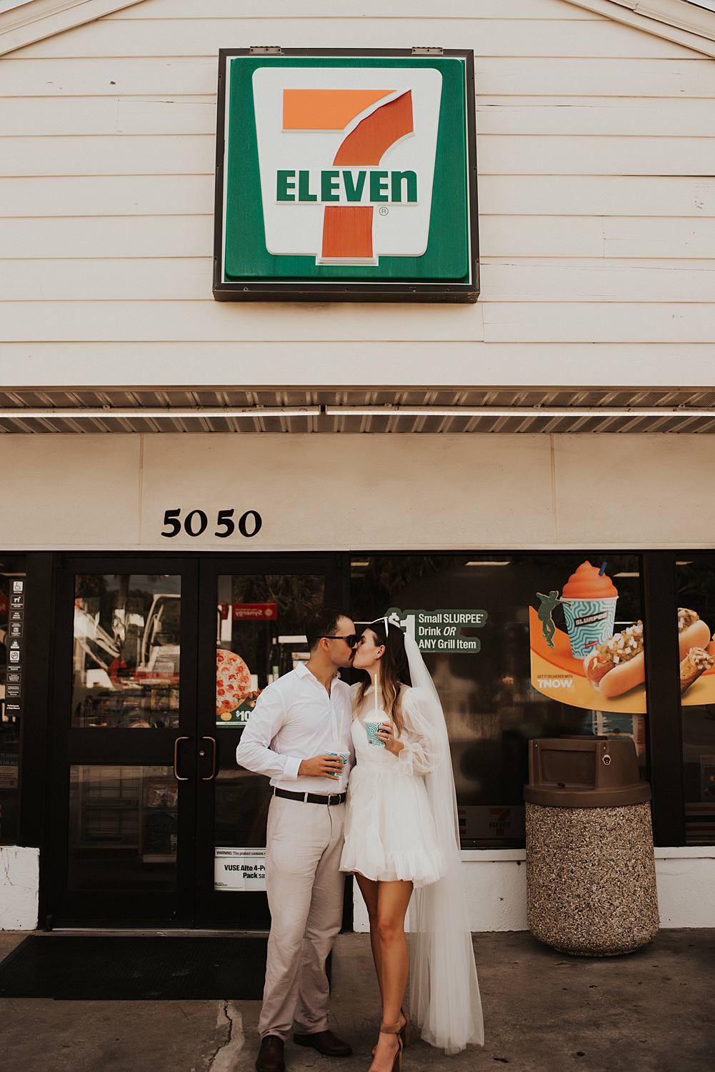 Bride and groom drinking slurpees at 7 eleven