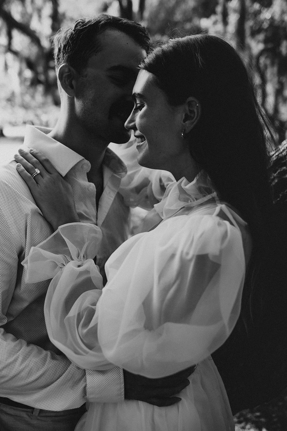 Bride and groom under oak trees