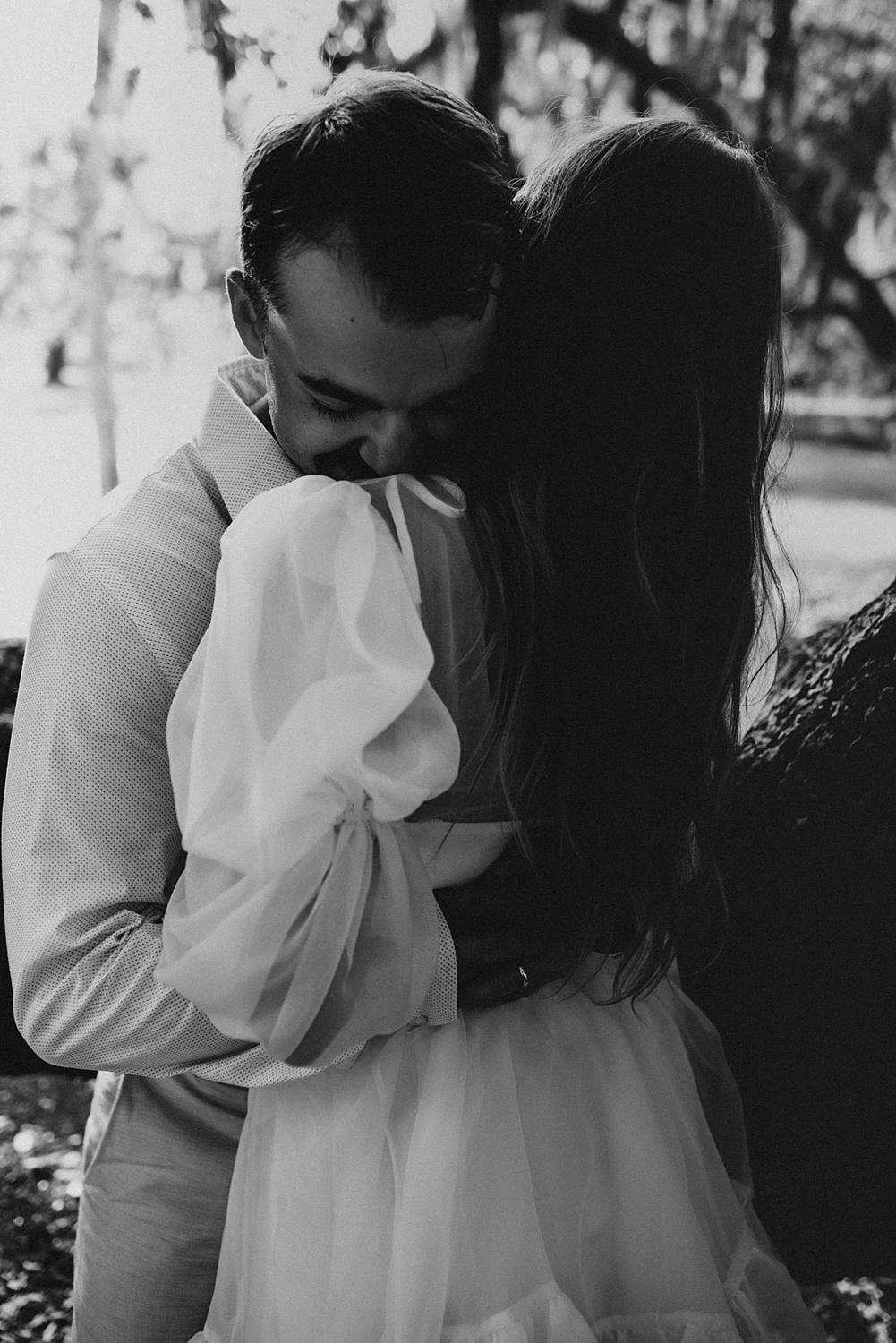 Bride and groom under oak trees