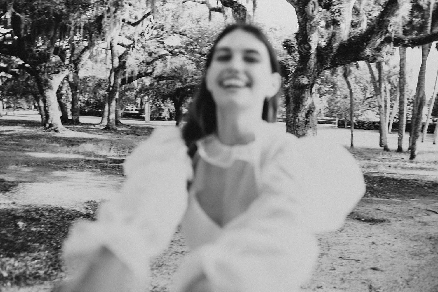 Bride and groom under oak trees