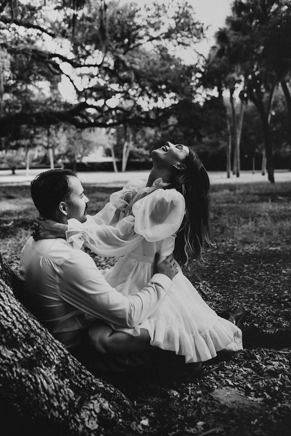 Bride and groom under oak trees