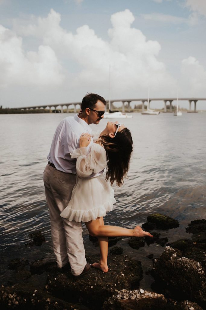 Bride and groom in front of Vero Beach bridge