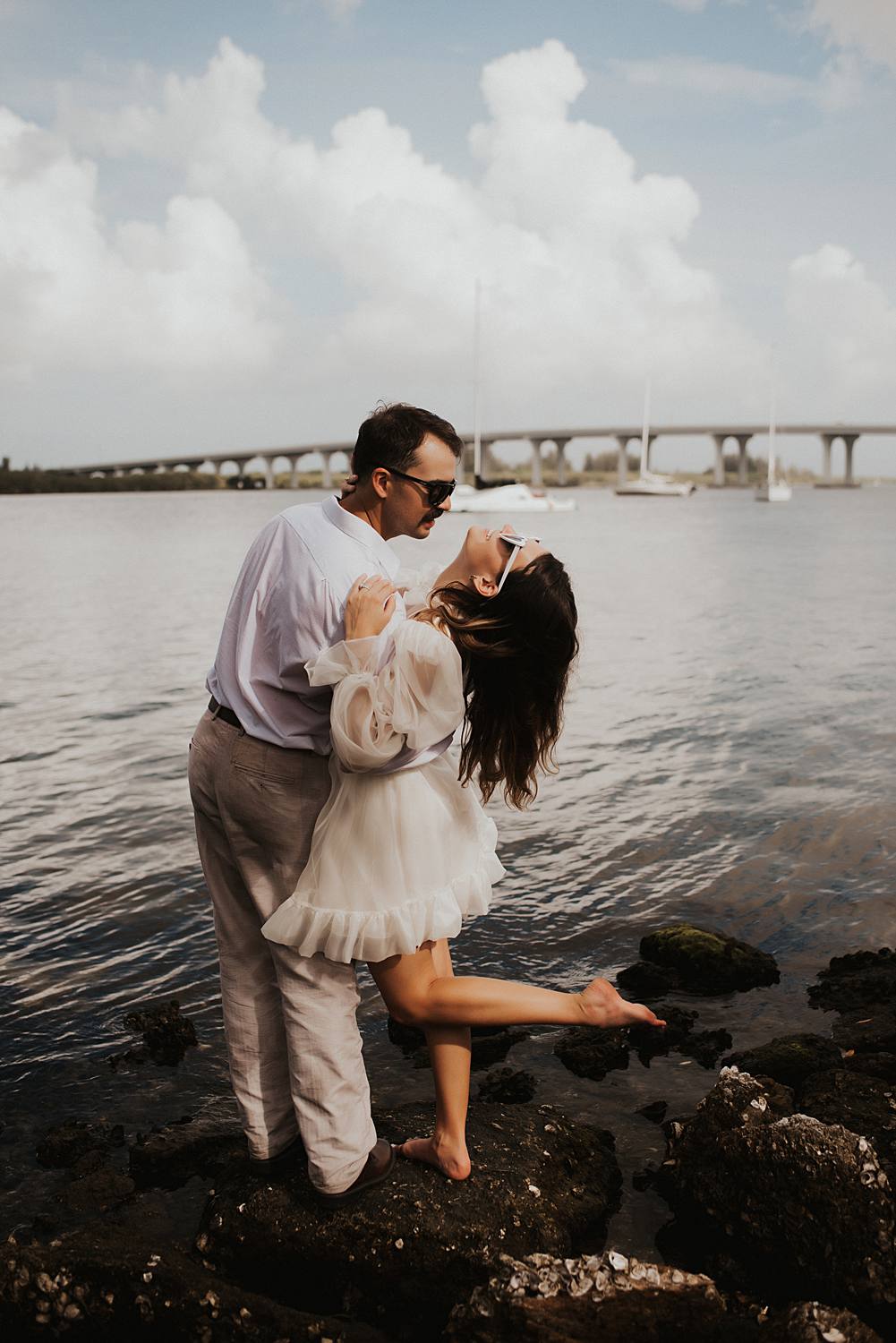 Bride and groom in front of Vero Beach bridge