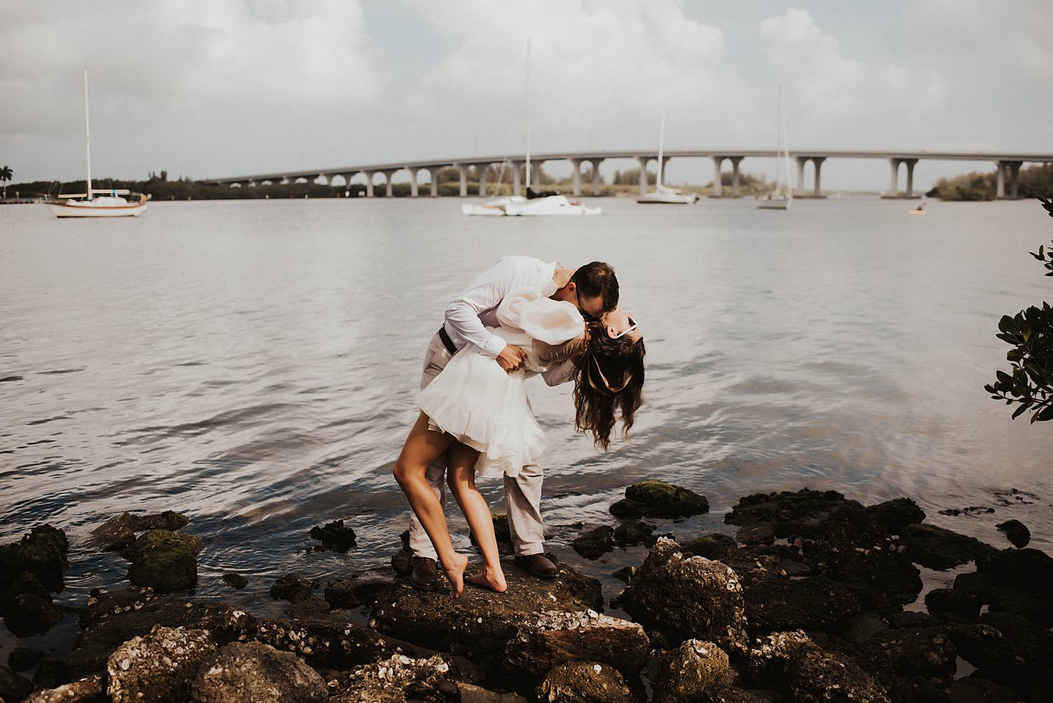 Bride and groom in front of Vero Beach bridge